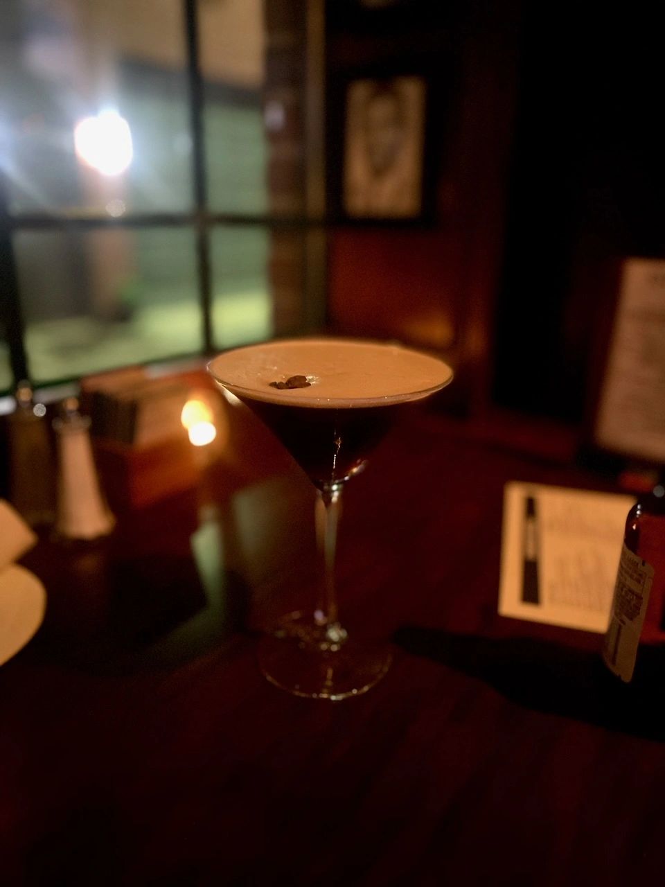 Cocktail with creamy foam at the bar