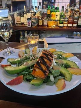 Grilled protein with avocado and greens
